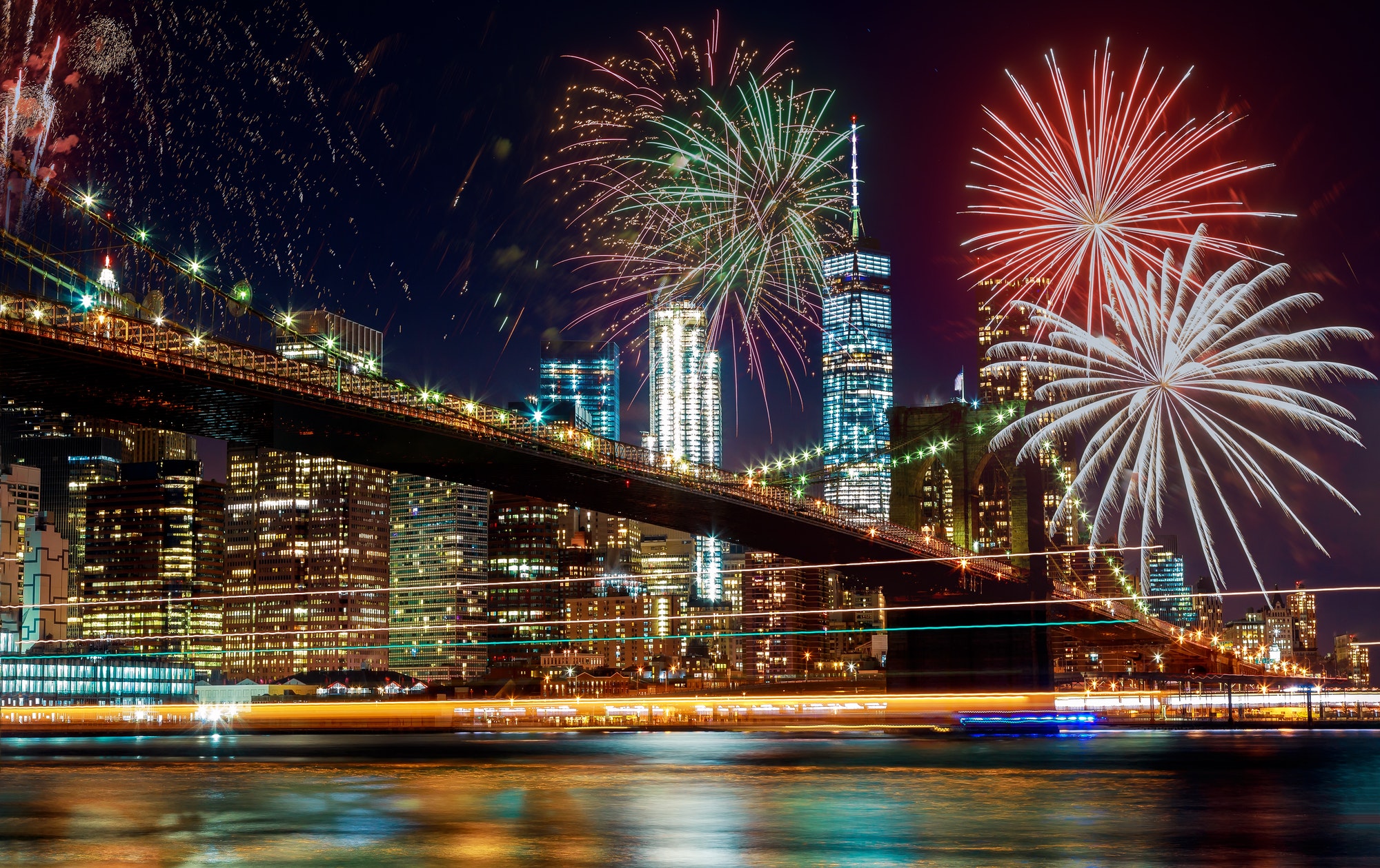 Colorful holiday fireworks panoramic view New York city Manhattan downtown skyline at night with